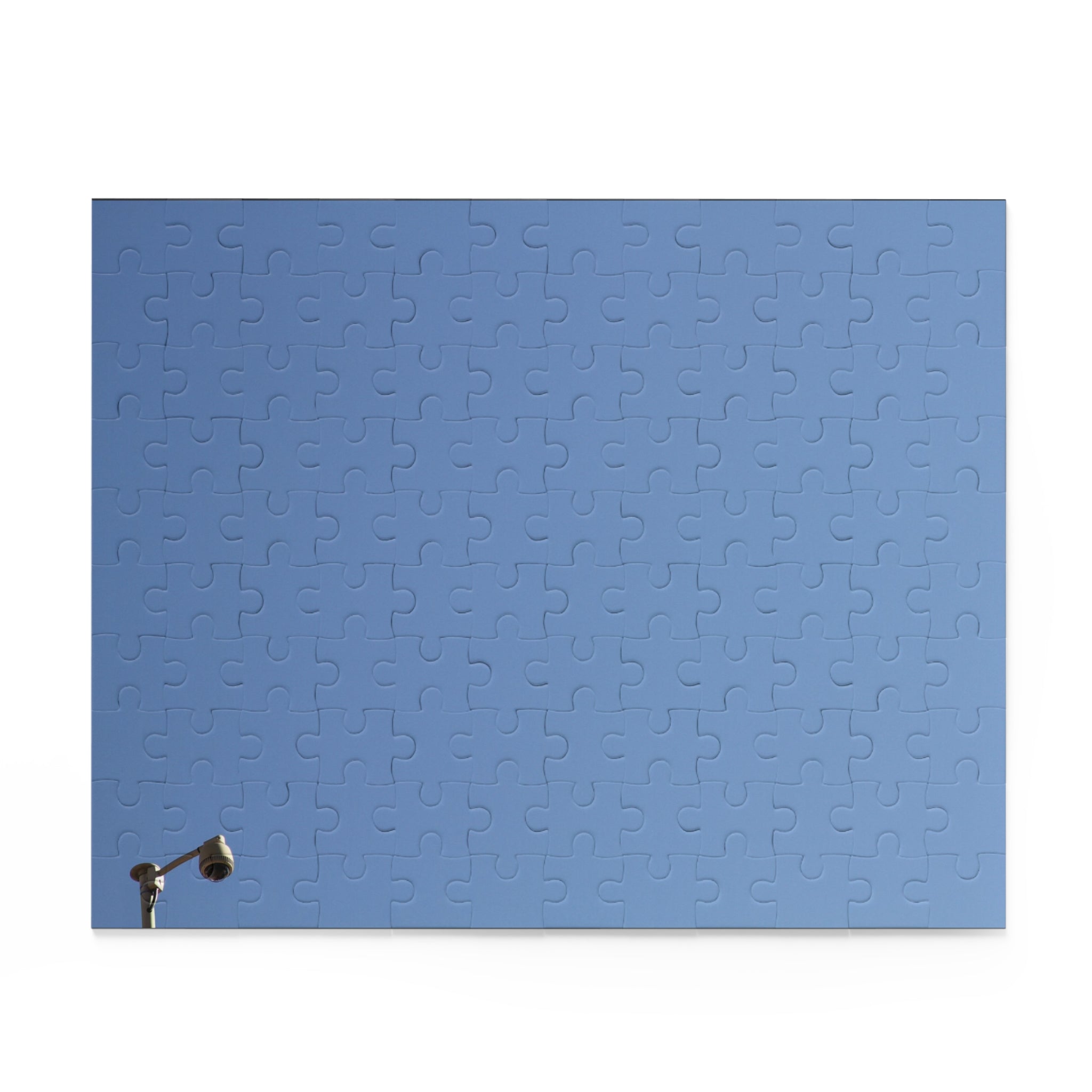 Blue puzzle mat with a streetlight on a white background