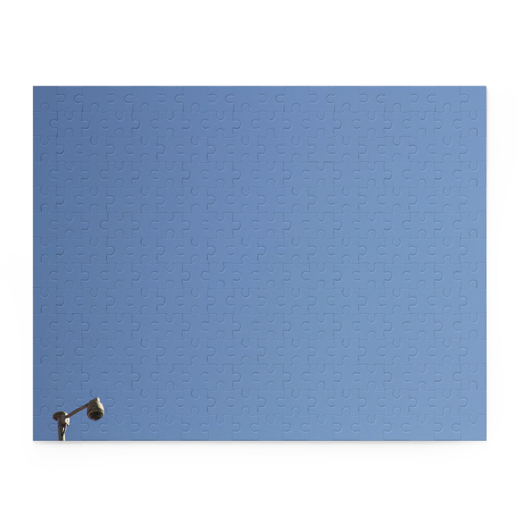 Blue textured panel with a light fixture on a white background