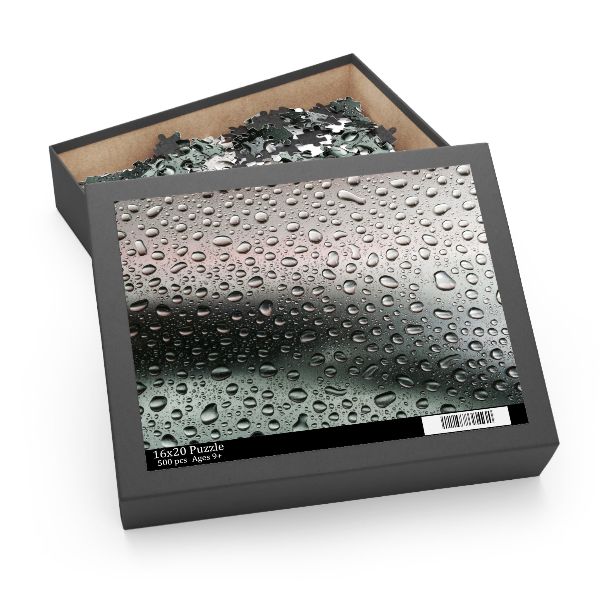 Jigsaw puzzle box with a water droplets design on the cover