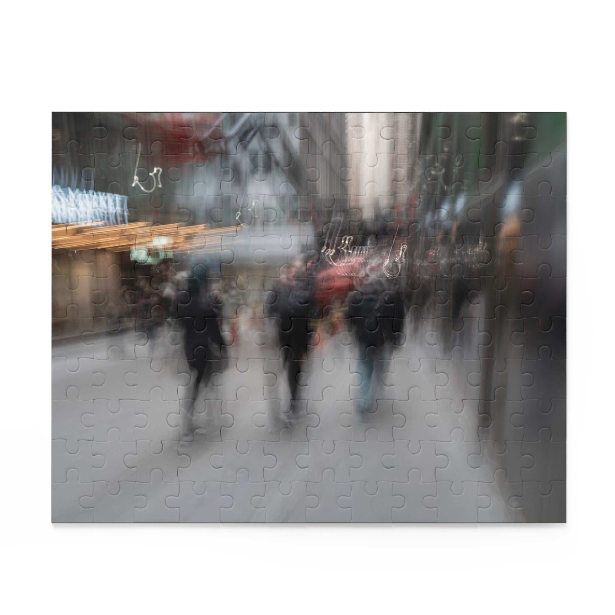 Blurred image of people walking on a city street with a puzzle effect.