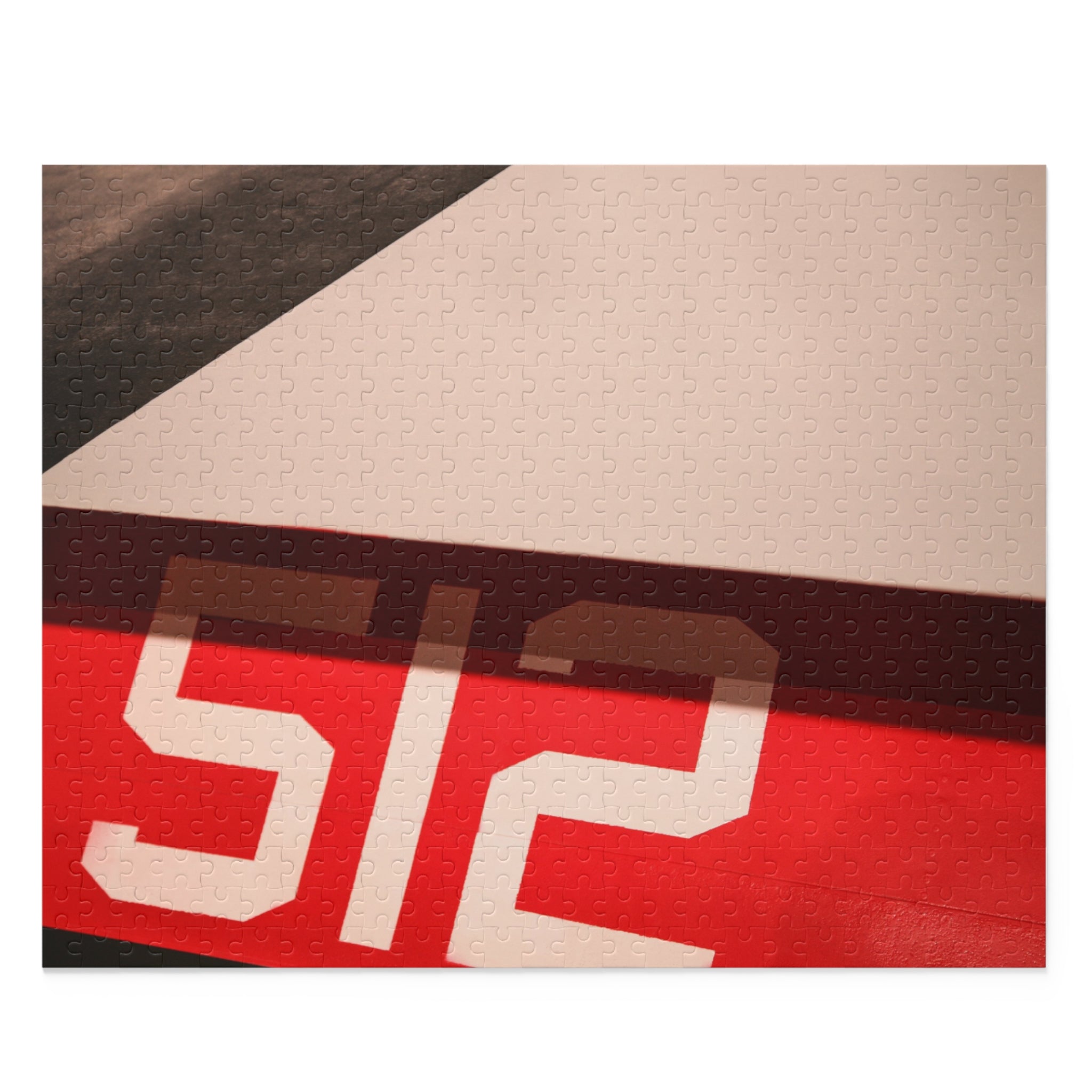 Close-up of a sports jersey with '512' printed on it, featuring red, black, and beige colors.