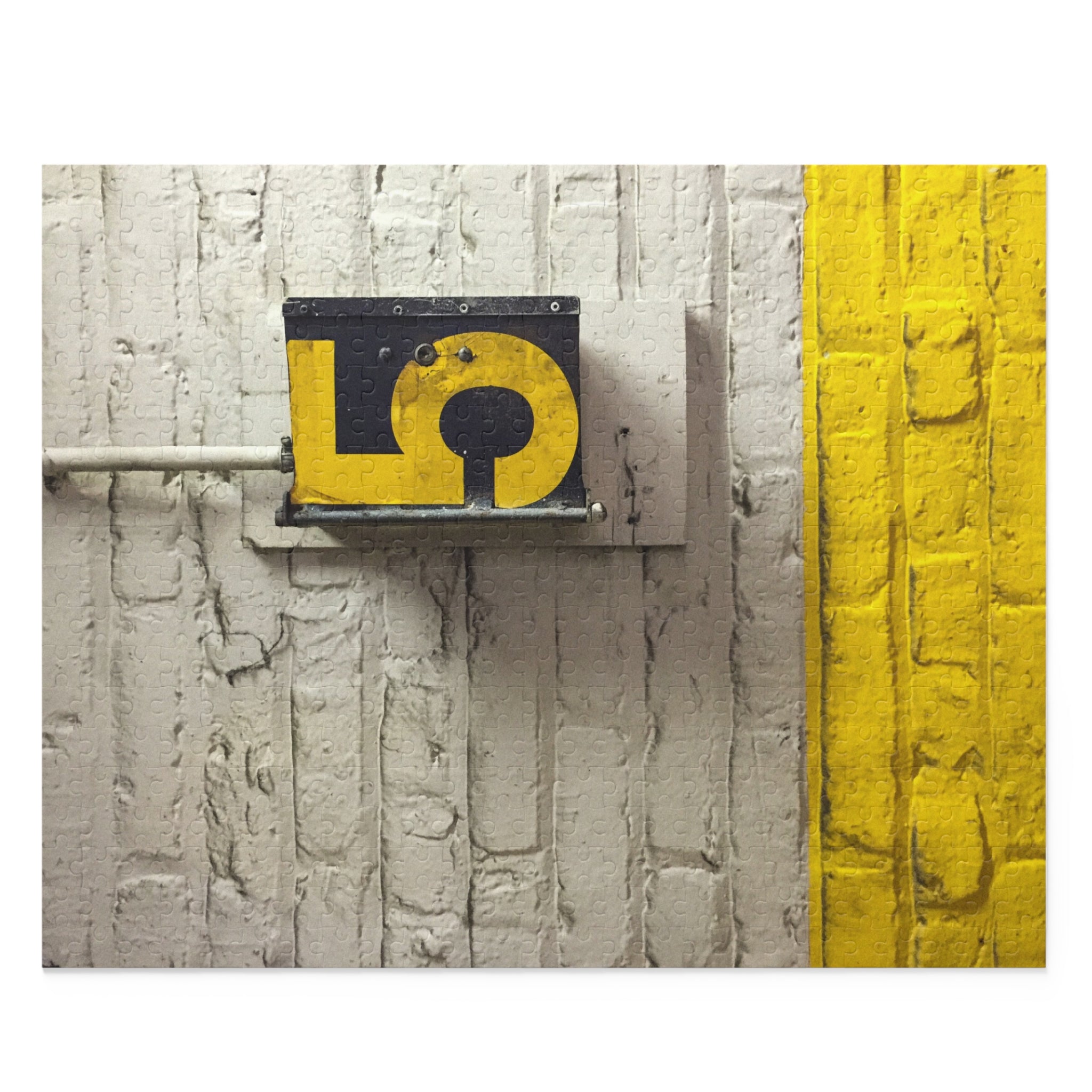 Yellow and black sign on a textured wall with a yellow stripe.