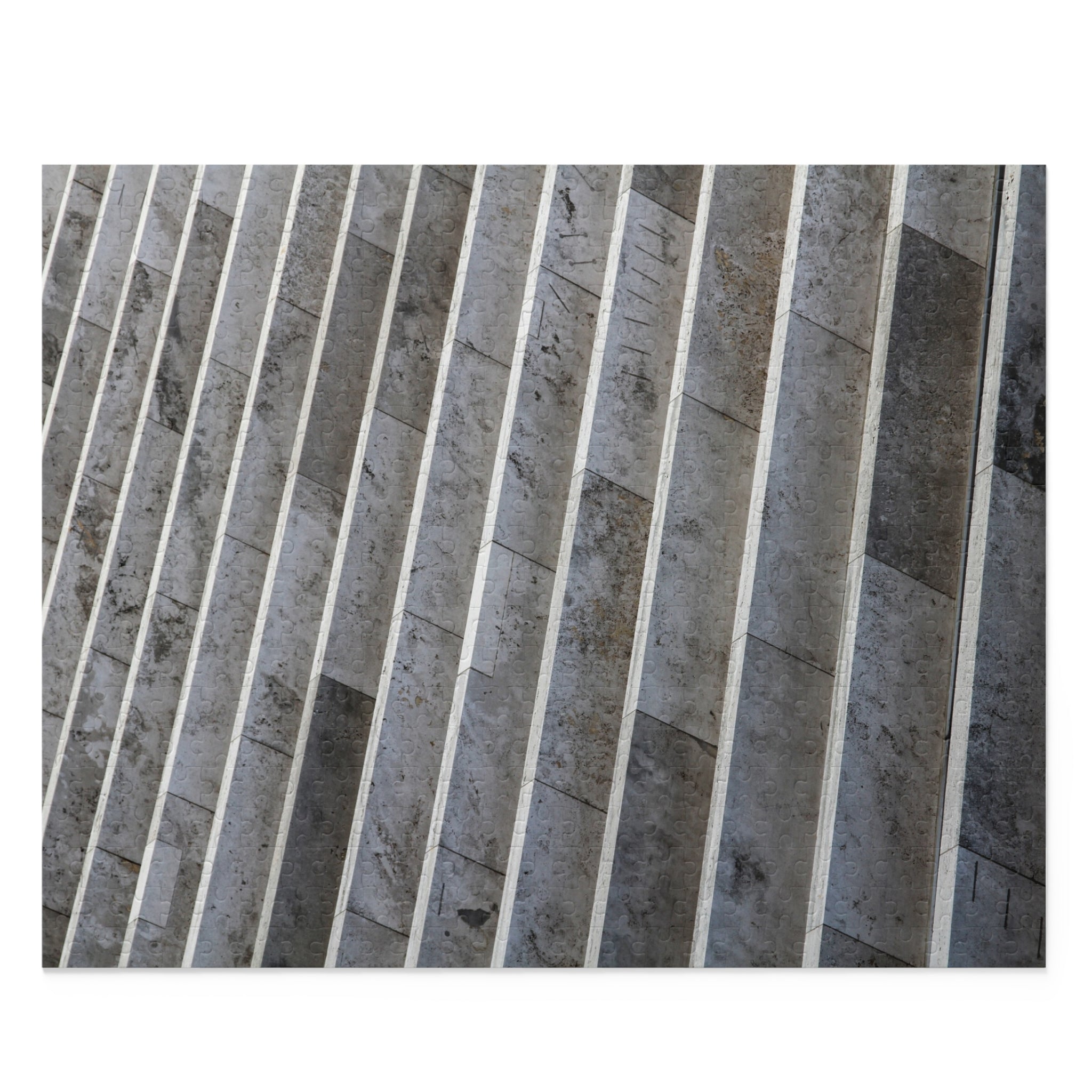Close-up of a patterned tile with vertical stripes on a white background