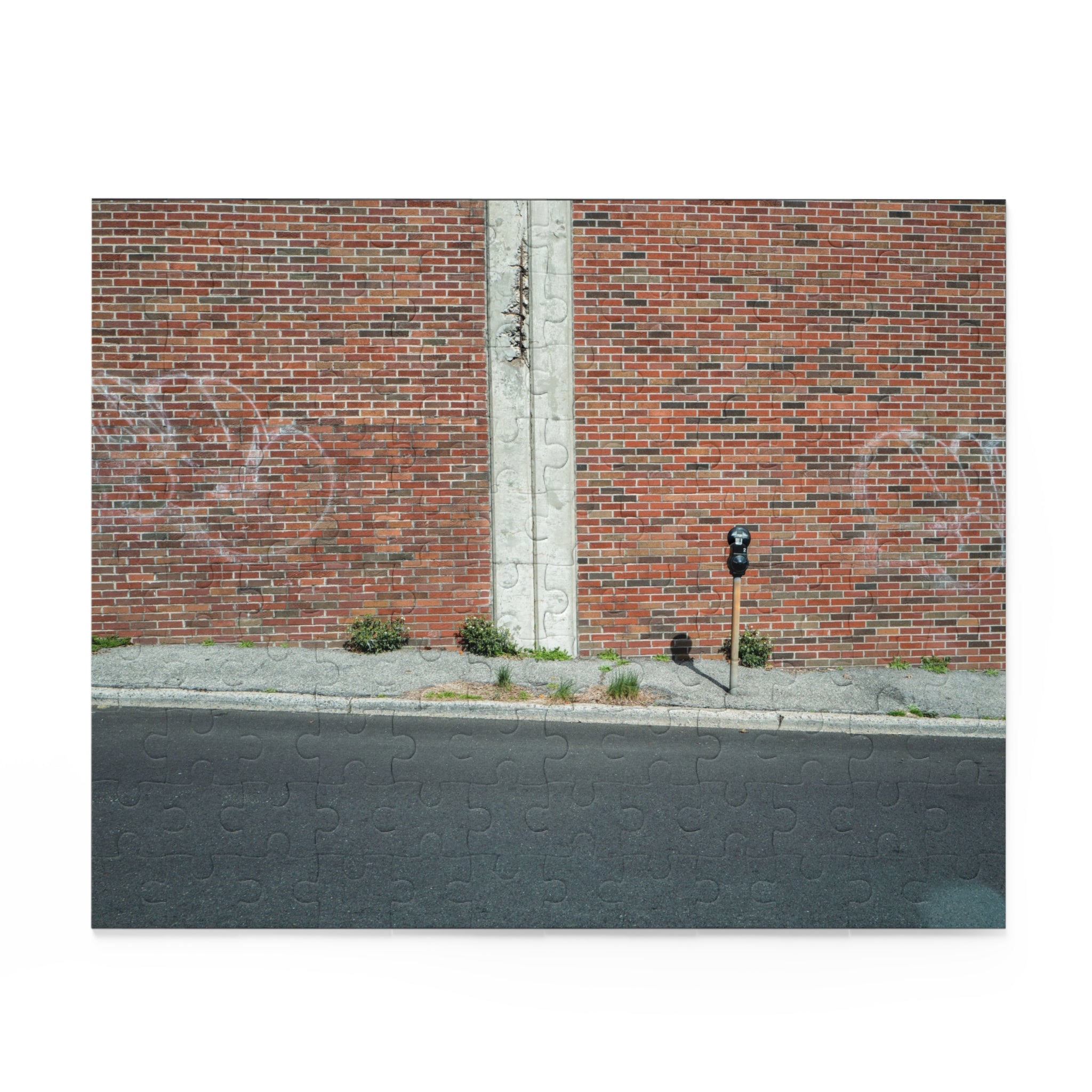 Brick wall with graffiti on a street corner