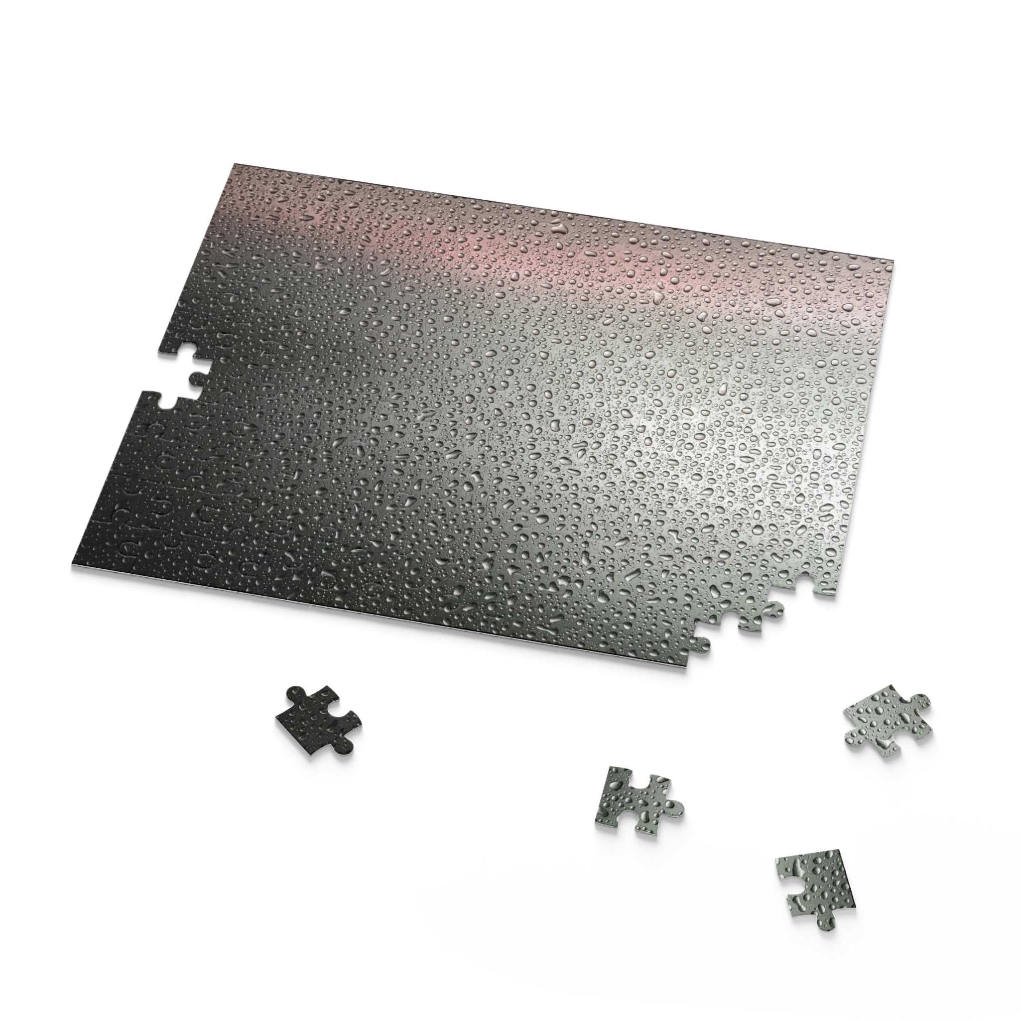 Metallic puzzle mat with scattered puzzle pieces on a white background