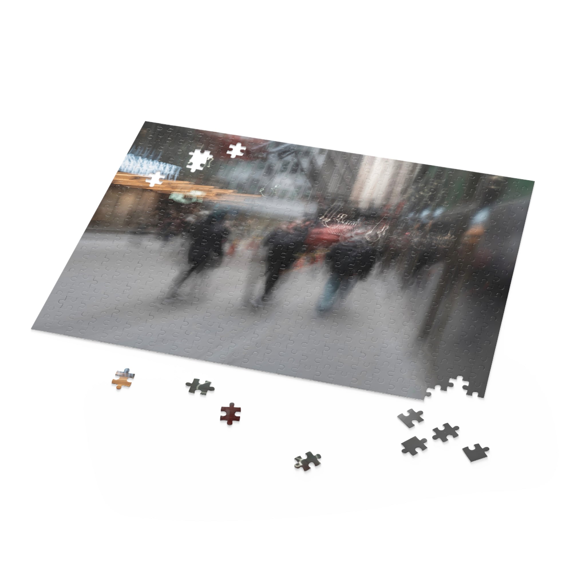 Jigsaw puzzle with a partially completed scene of people on a street, missing pieces scattered around.