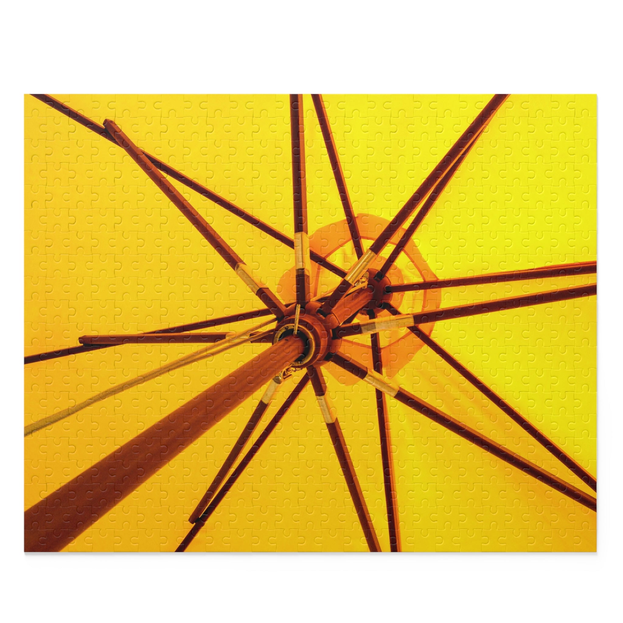 Close-up of an umbrella's wooden frame against a yellow background