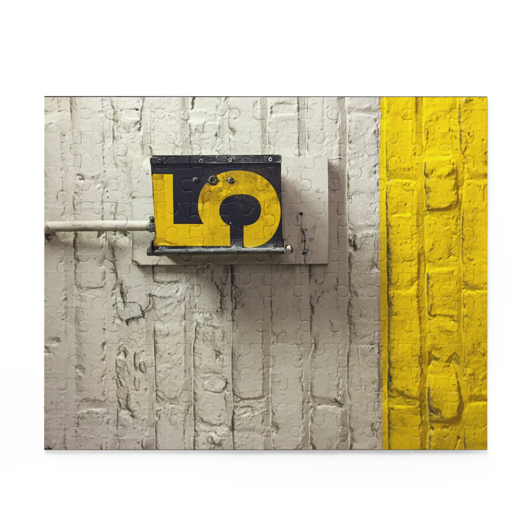 Decorative wall art with a yellow question mark design on a textured white and gray background.