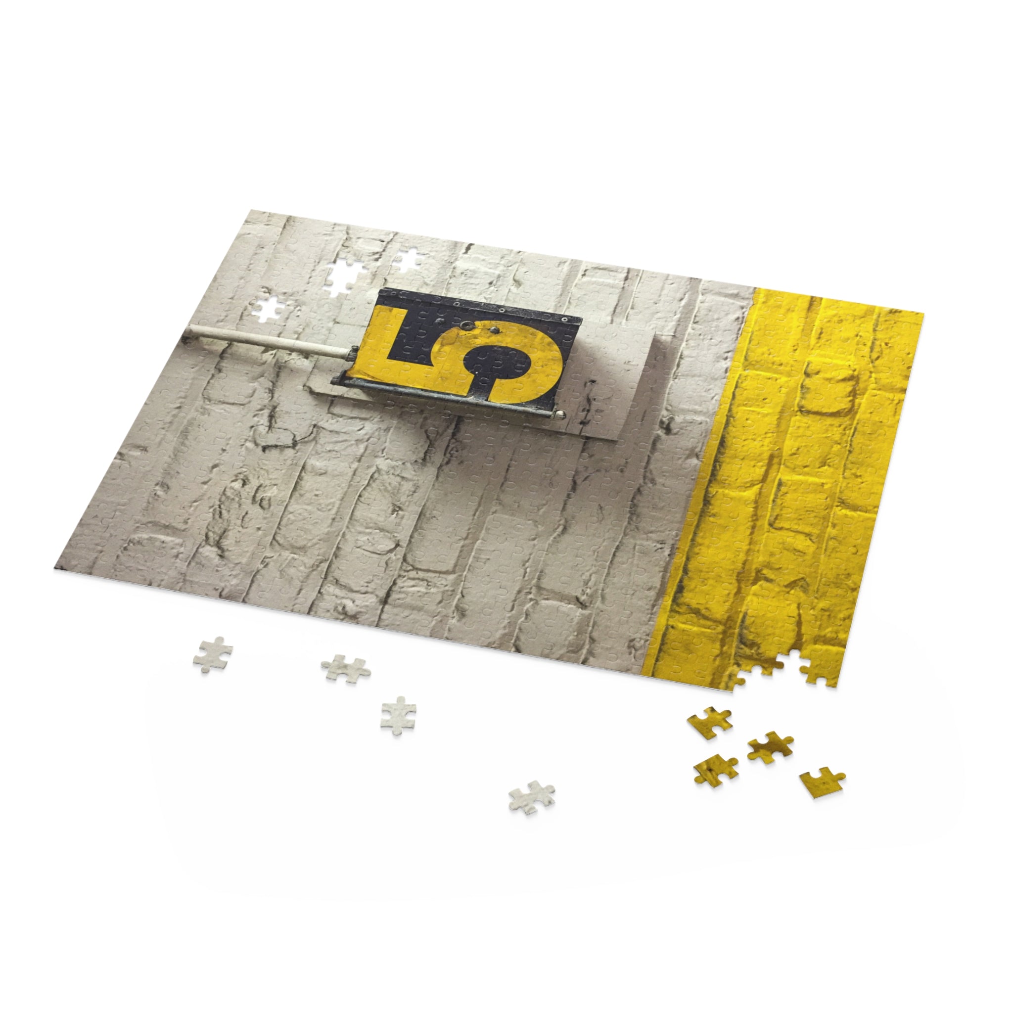Jigsaw puzzle with a street sign and yellow line on a white background
