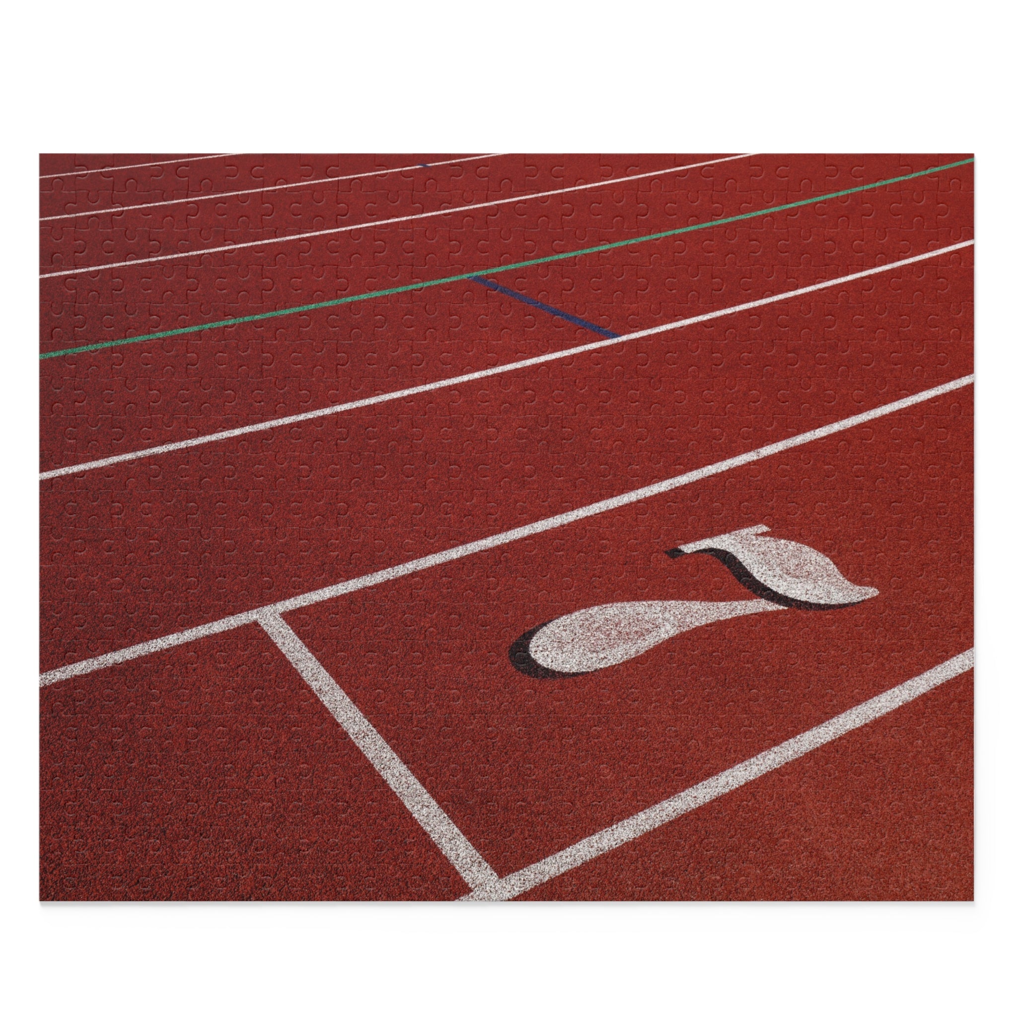 Close-up of a red running track with white lanes and a logo.