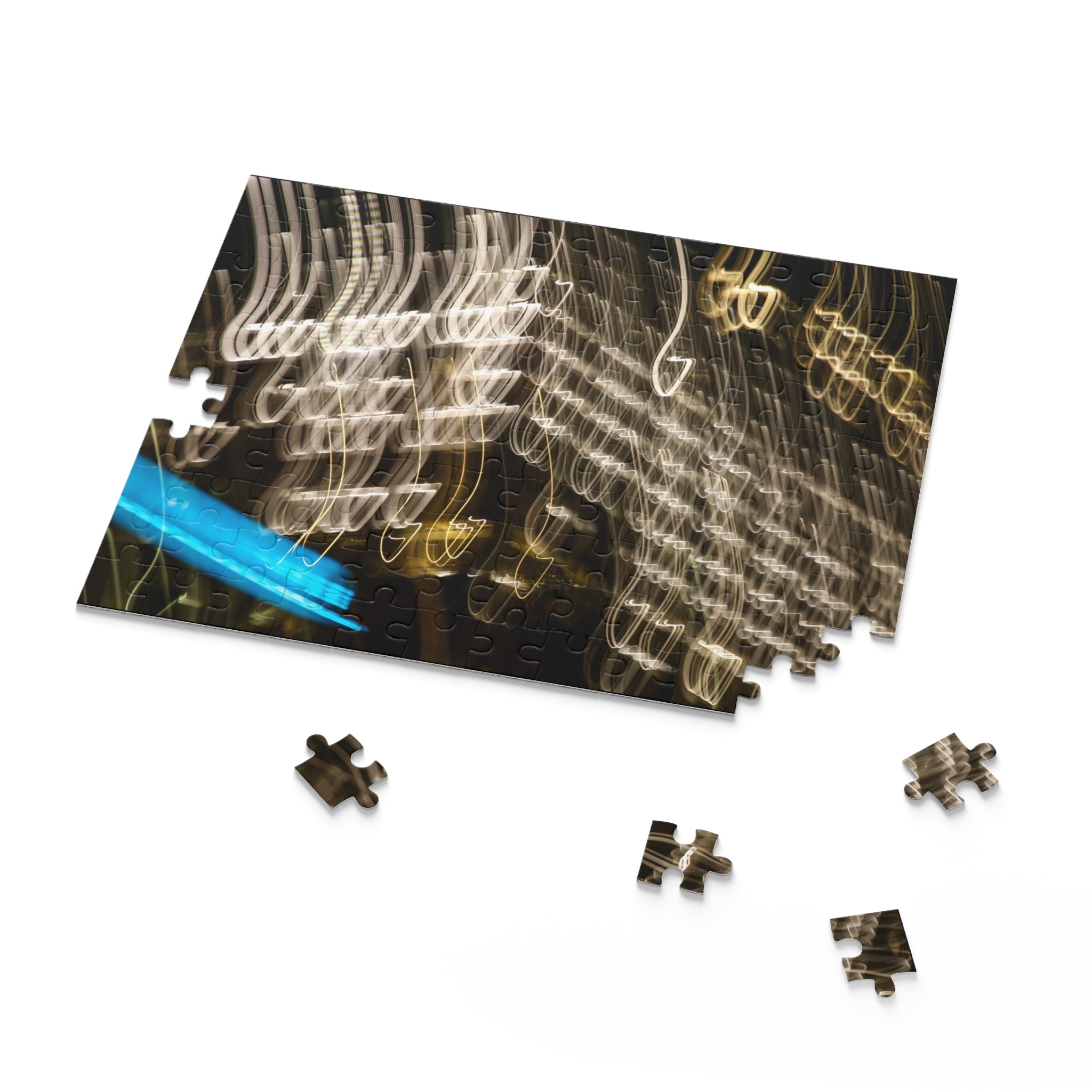 Jigsaw puzzle with a completed section and missing pieces on a white background