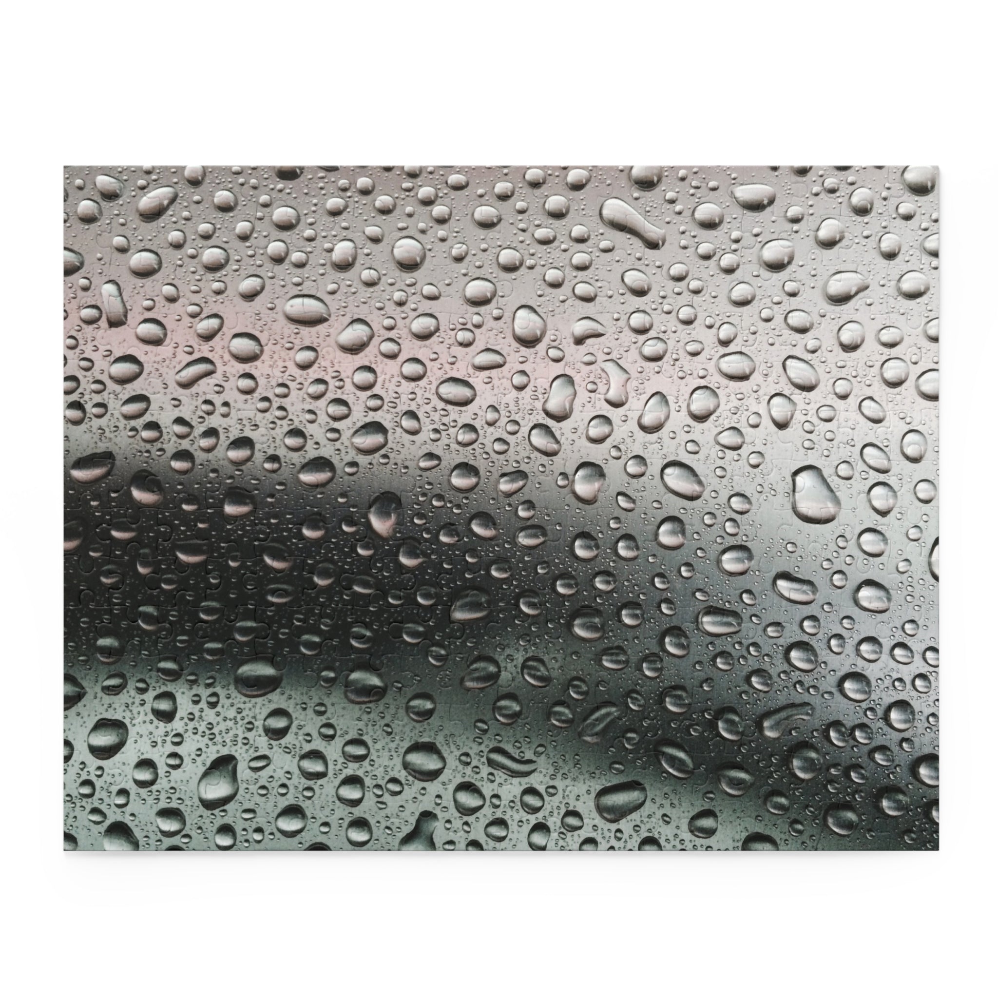 Close-up of water droplets on a metallic surface