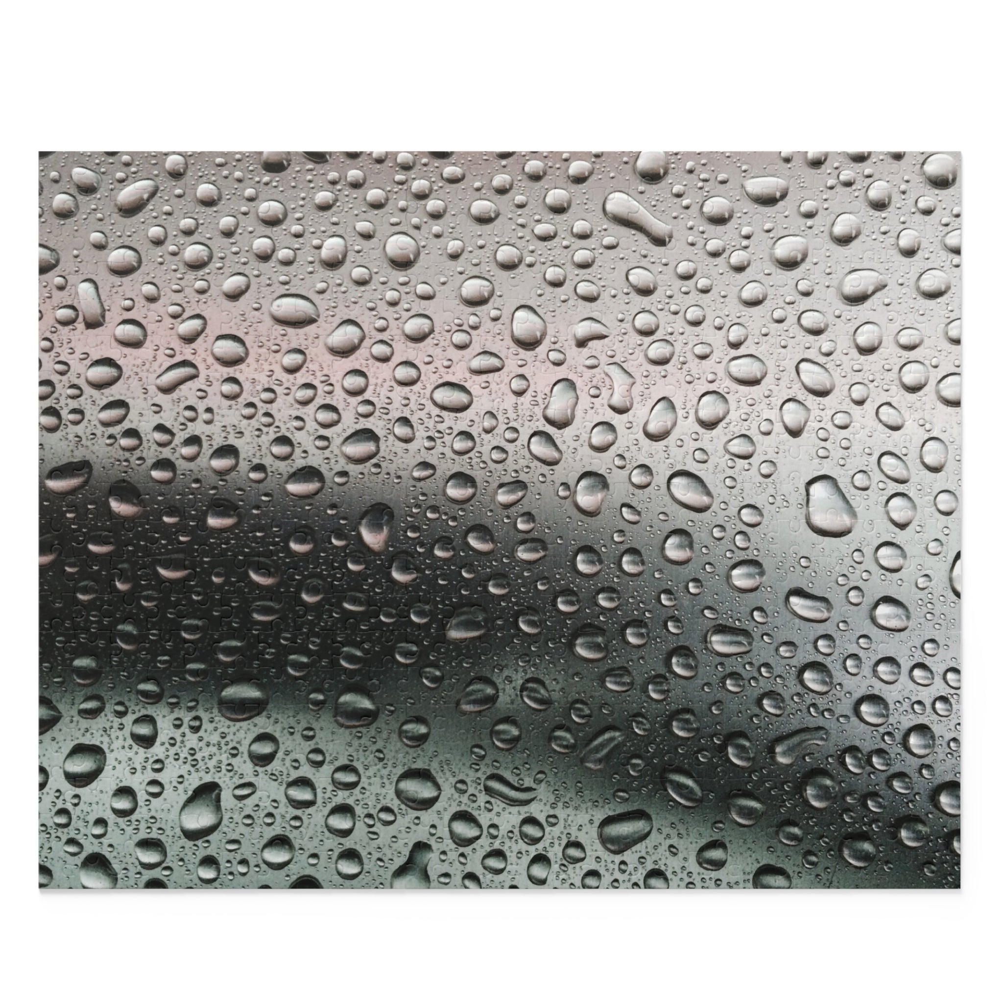 Water droplets on a glass surface with a gradient background