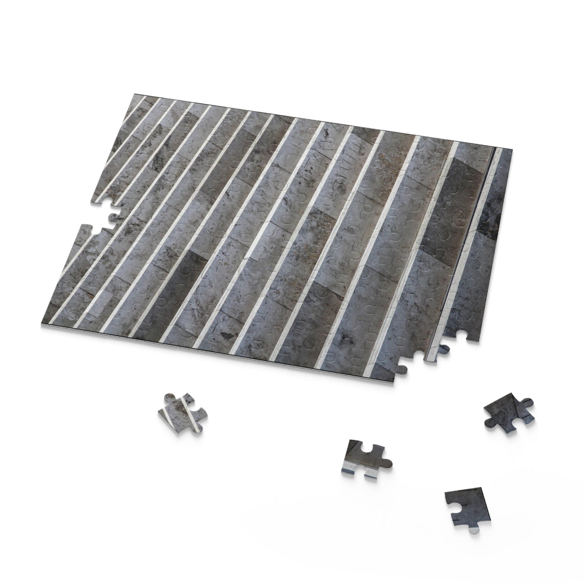 Gray striped interlocking tile with additional tiles on a white background